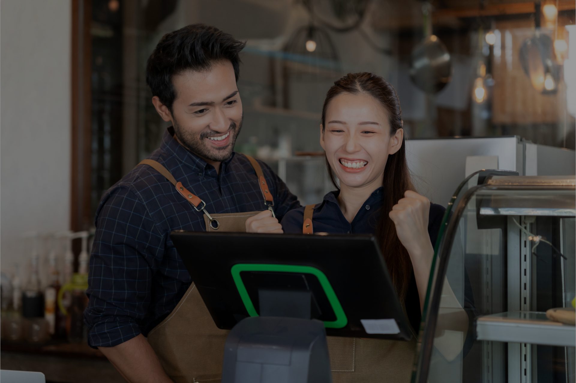 Restaurant employees setting up on POS system